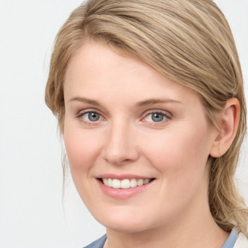 Joyful white young-adult female with medium  brown hair and blue eyes