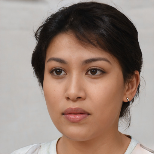 Neutral latino young-adult female with medium  brown hair and brown eyes