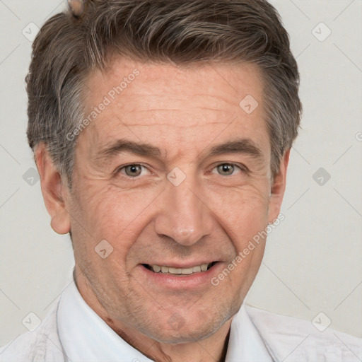 Joyful white middle-aged male with short  brown hair and brown eyes