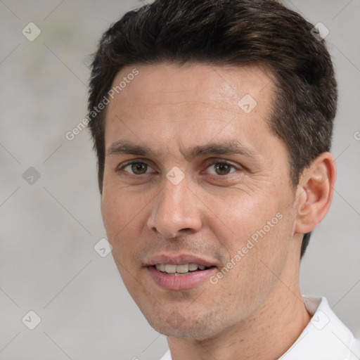 Joyful white adult male with short  brown hair and brown eyes