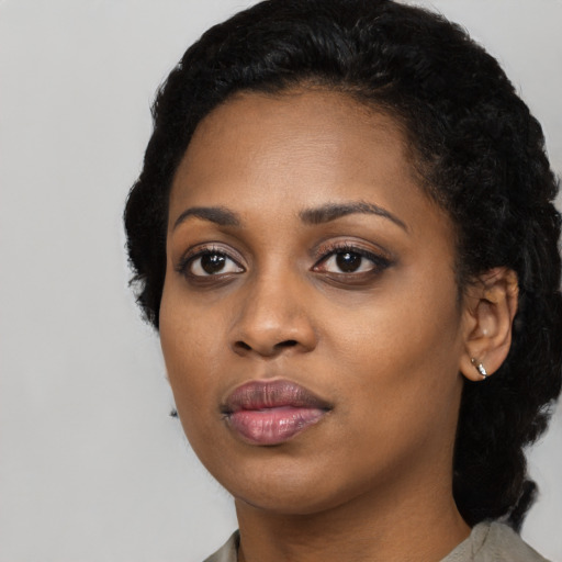 Neutral black young-adult female with medium  black hair and brown eyes