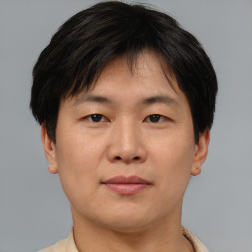 Neutral asian young-adult male with short  brown hair and brown eyes