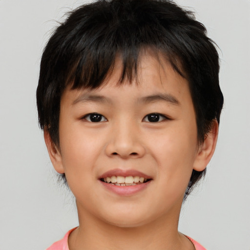 Joyful asian child female with short  brown hair and brown eyes