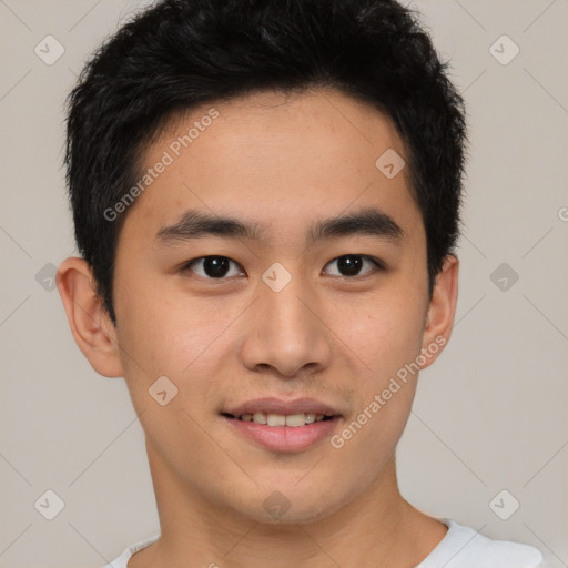 Joyful asian young-adult male with short  brown hair and brown eyes