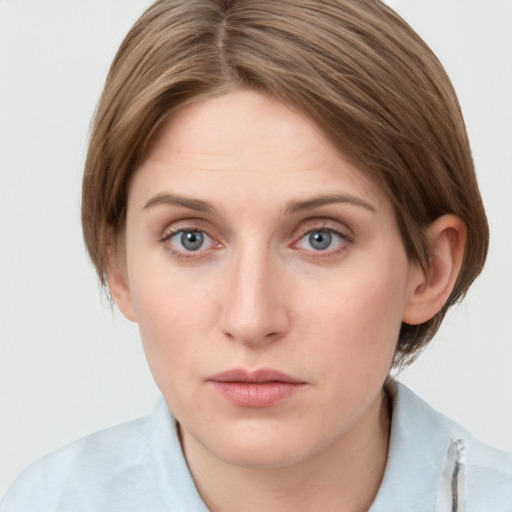 Neutral white young-adult female with medium  brown hair and grey eyes