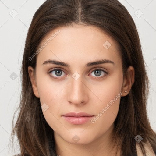 Neutral white young-adult female with long  brown hair and brown eyes