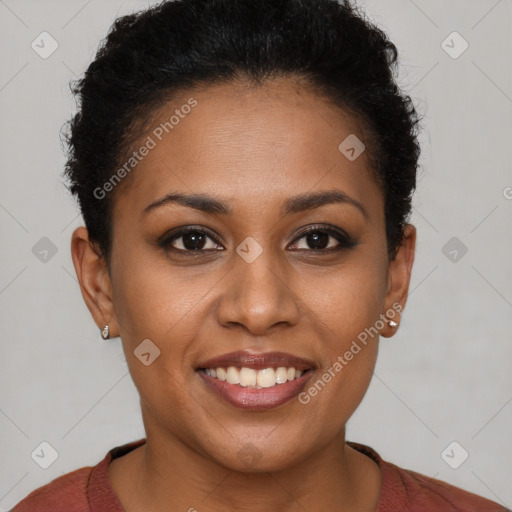 Joyful black young-adult female with short  brown hair and brown eyes