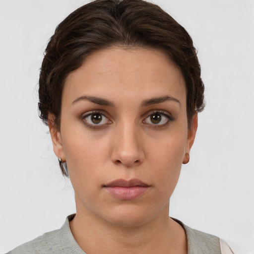Neutral white young-adult female with short  brown hair and brown eyes