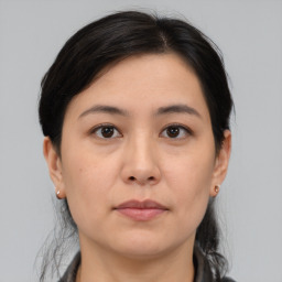 Neutral asian young-adult female with medium  brown hair and brown eyes