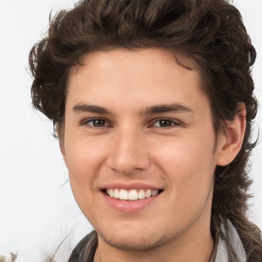 Joyful white young-adult male with medium  brown hair and brown eyes