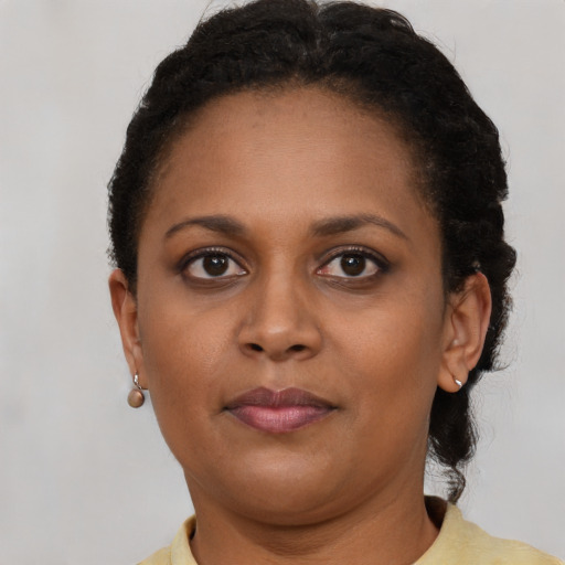 Neutral black young-adult female with short  brown hair and brown eyes