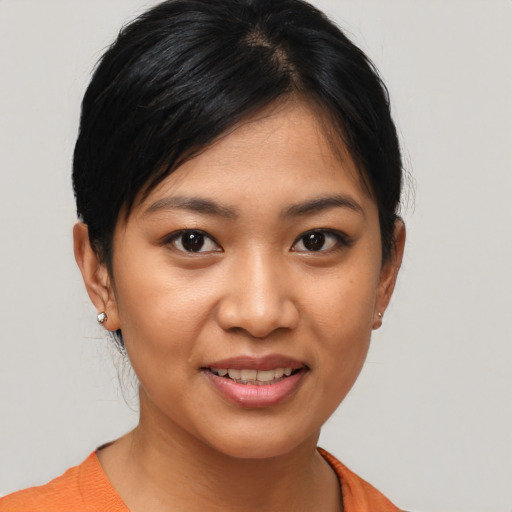 Joyful asian young-adult female with short  black hair and brown eyes