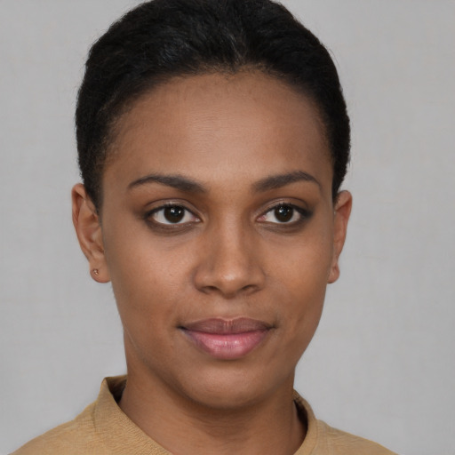 Joyful latino young-adult female with short  brown hair and brown eyes