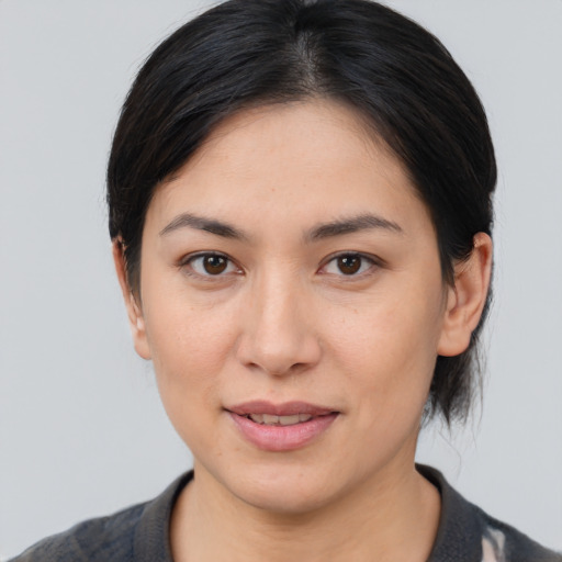 Joyful white young-adult female with medium  brown hair and brown eyes