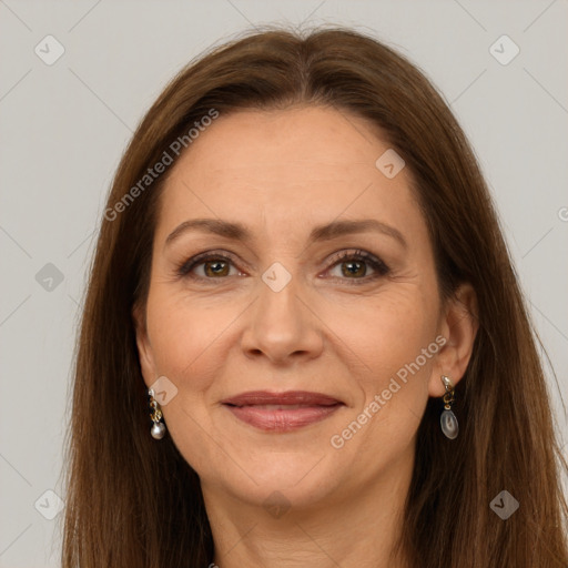 Joyful white adult female with long  brown hair and grey eyes