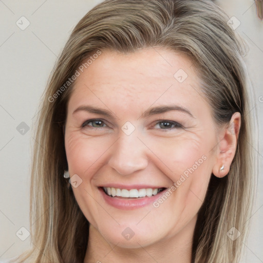 Joyful white young-adult female with long  brown hair and grey eyes