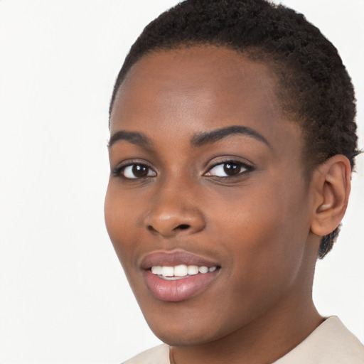 Joyful black young-adult female with short  brown hair and brown eyes