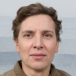 Joyful white adult male with short  brown hair and grey eyes