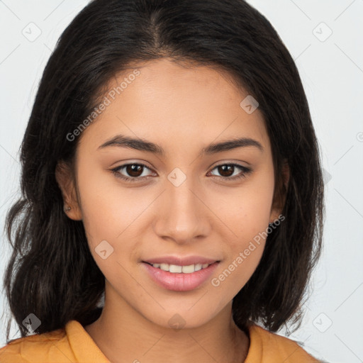 Joyful latino young-adult female with long  brown hair and brown eyes