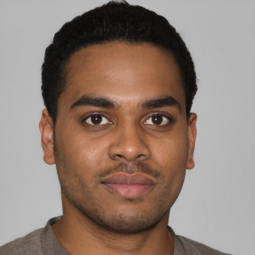 Neutral latino young-adult male with short  brown hair and brown eyes