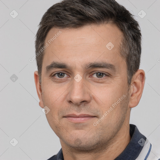 Joyful white adult male with short  brown hair and brown eyes