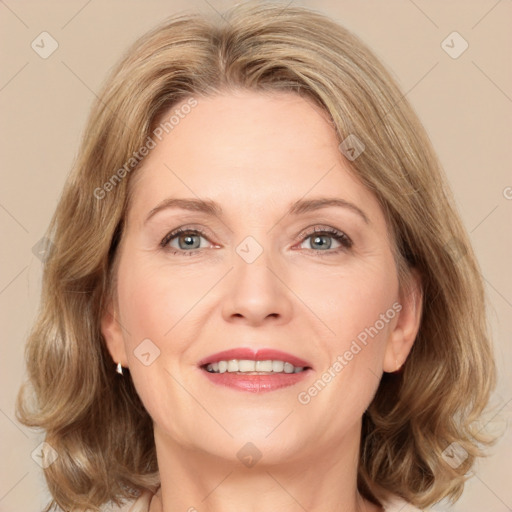 Joyful white adult female with medium  brown hair and grey eyes