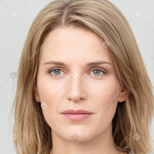 Joyful white young-adult female with long  brown hair and blue eyes