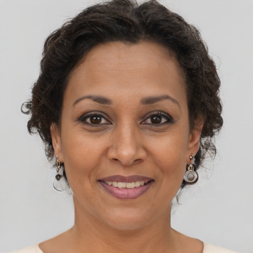 Joyful white adult female with short  brown hair and brown eyes