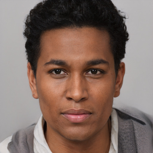 Neutral black young-adult male with short  black hair and brown eyes