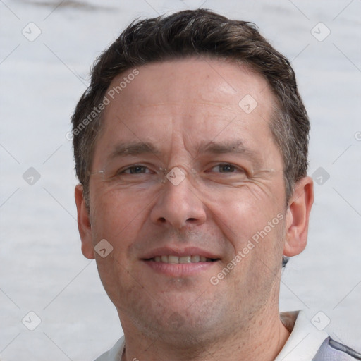 Joyful white adult male with short  brown hair and grey eyes