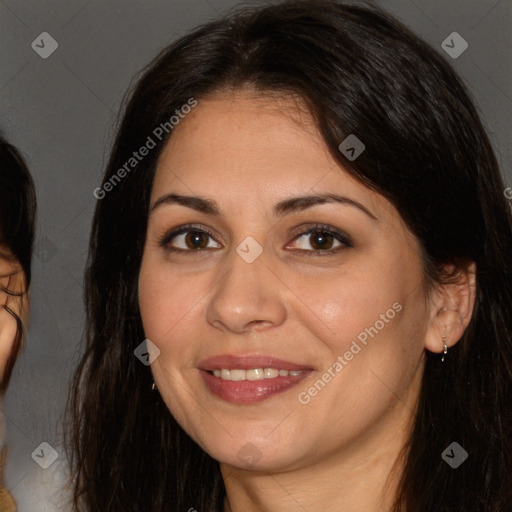 Joyful white adult female with long  brown hair and brown eyes