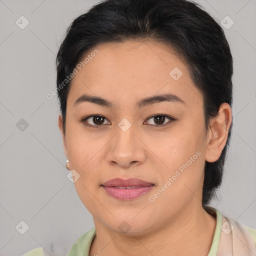 Joyful latino young-adult female with medium  brown hair and brown eyes