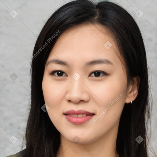 Joyful asian young-adult female with long  black hair and brown eyes