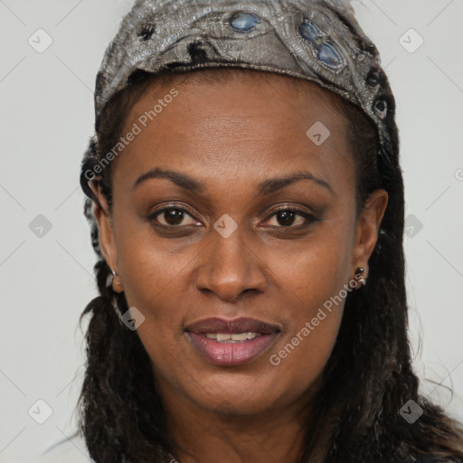 Joyful black young-adult female with long  brown hair and brown eyes