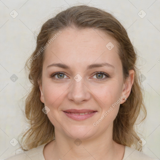 Joyful white young-adult female with medium  brown hair and green eyes