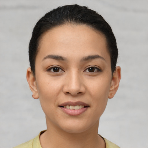 Joyful white young-adult female with short  brown hair and brown eyes