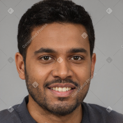 Joyful black young-adult male with short  black hair and brown eyes