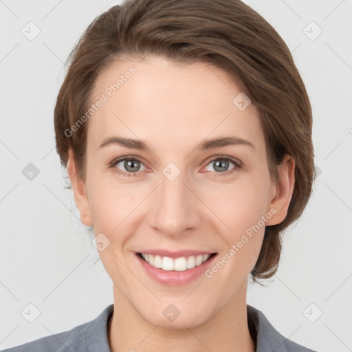 Joyful white young-adult female with medium  brown hair and grey eyes