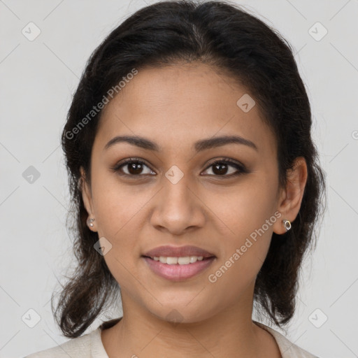 Joyful latino young-adult female with medium  brown hair and brown eyes