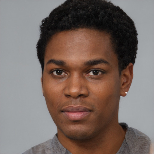 Neutral black young-adult male with short  black hair and brown eyes