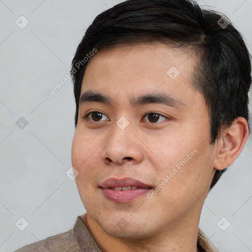 Joyful white young-adult male with short  black hair and brown eyes