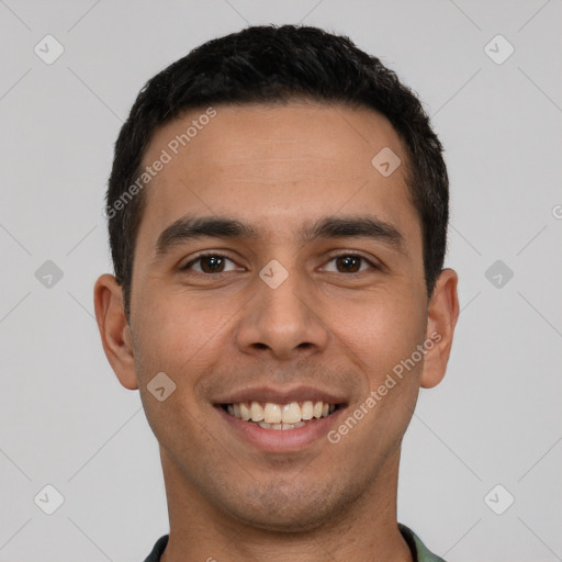 Joyful white young-adult male with short  black hair and brown eyes