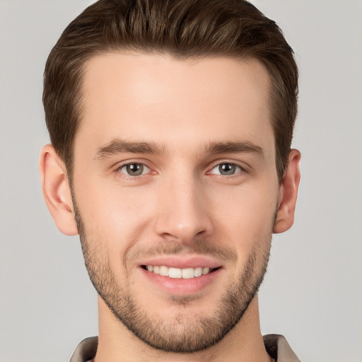 Joyful white young-adult male with short  brown hair and brown eyes