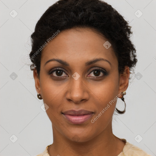 Joyful black young-adult female with short  brown hair and brown eyes