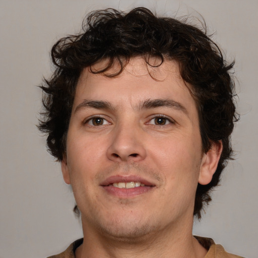 Joyful white young-adult male with medium  brown hair and brown eyes