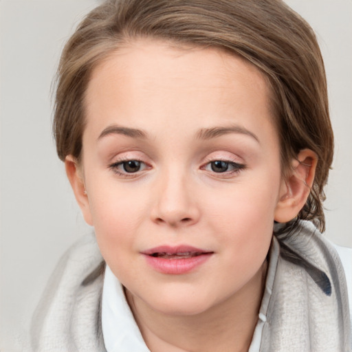 Joyful white child female with medium  brown hair and grey eyes