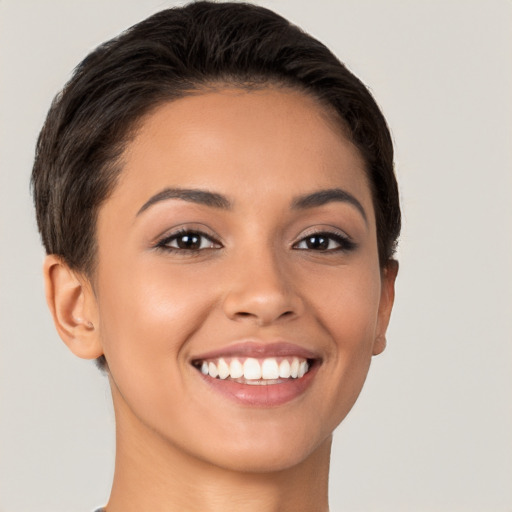 Joyful white young-adult female with short  brown hair and brown eyes