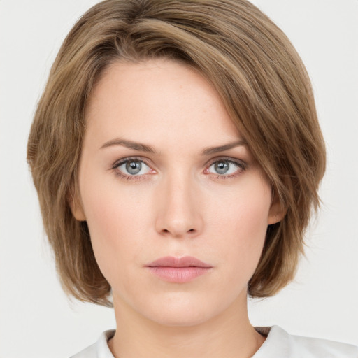 Neutral white young-adult female with medium  brown hair and green eyes