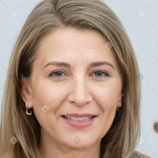 Joyful white adult female with long  brown hair and brown eyes