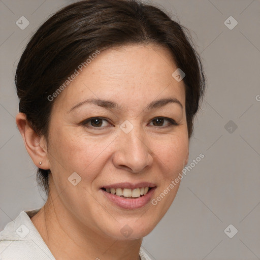 Joyful white adult female with medium  brown hair and brown eyes